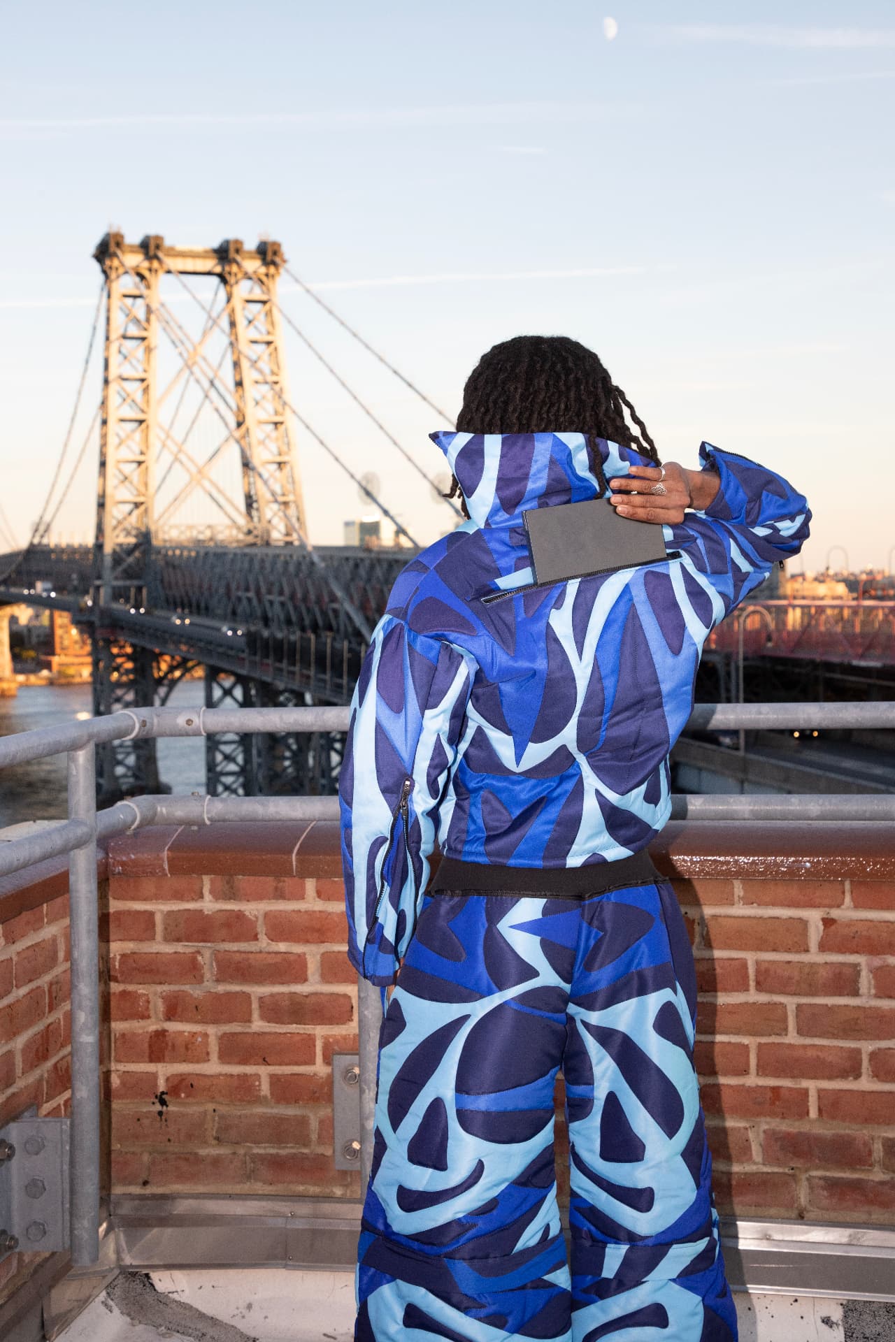 eonic blue puffer suit on a williamsburg rooftop