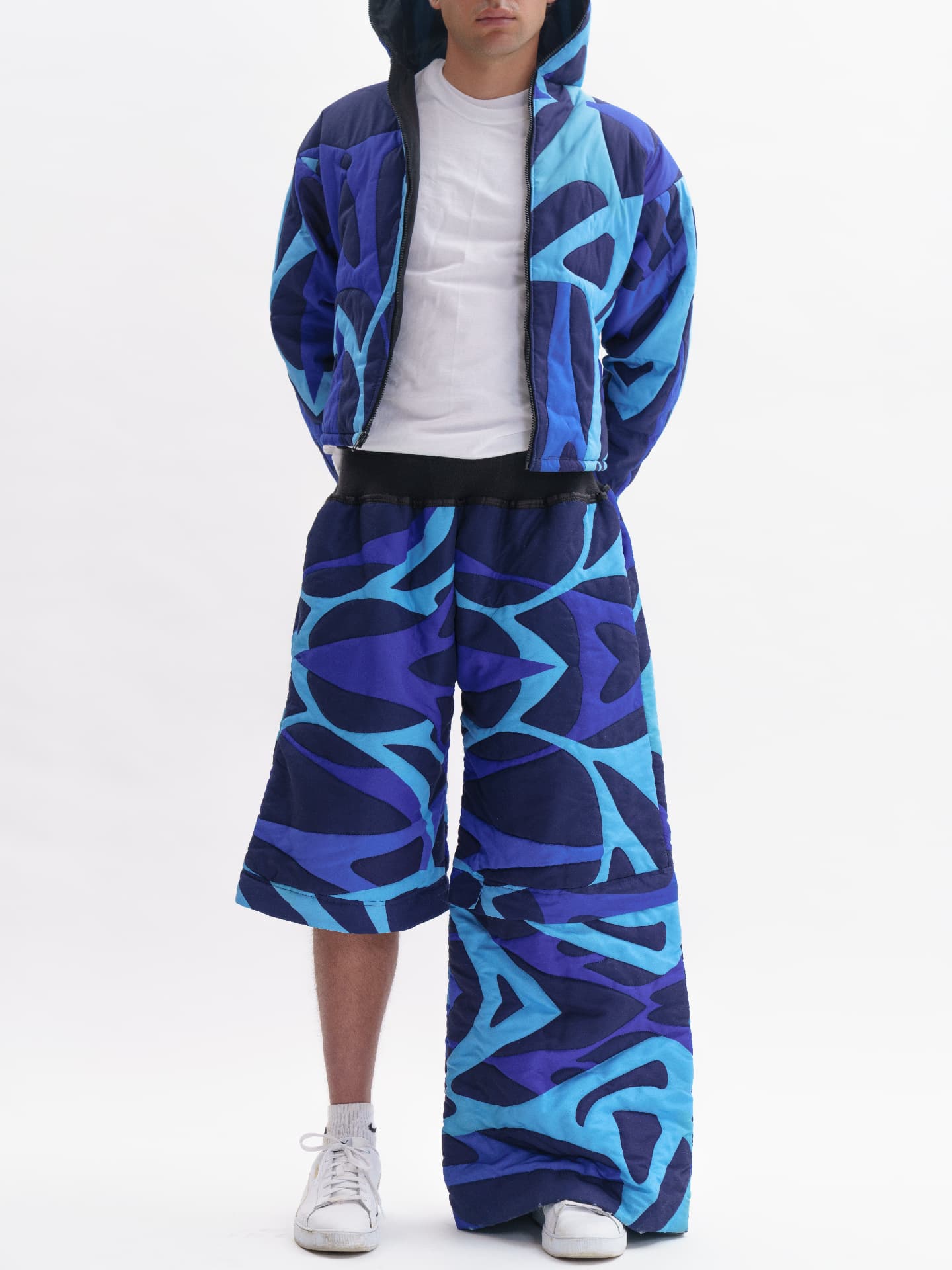 eonic blue patterned puffer jacket and wide trousers