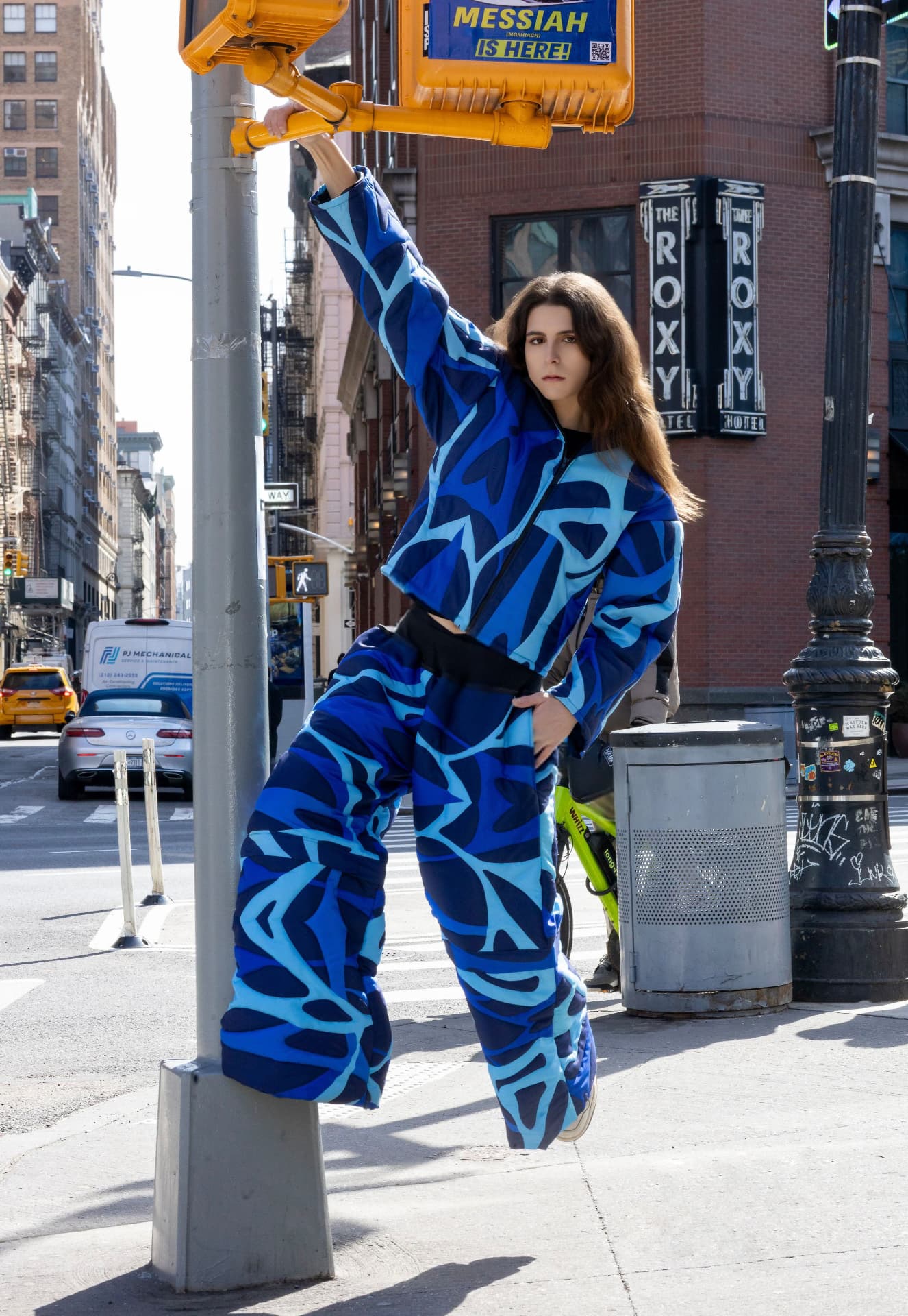 eonic blue puffer suit on a soho street corner